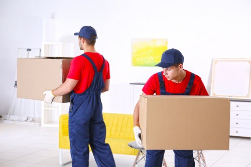 Removal team preparing flat removals in Brompton with boxes and furniture