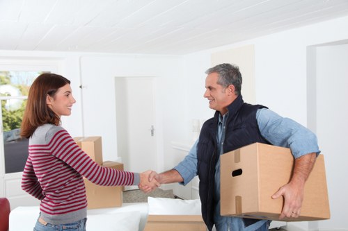 Moving day preparation for Brompton homeowners with labelled boxes and furniture protection