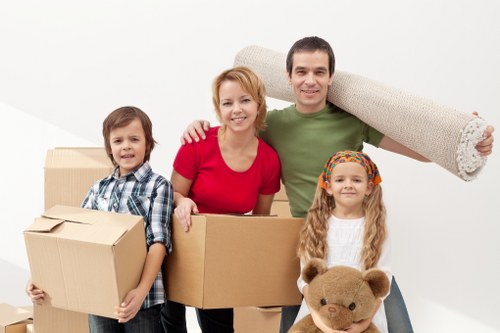 Loading furniture and boxes into a van for a Brompton collection or delivery job