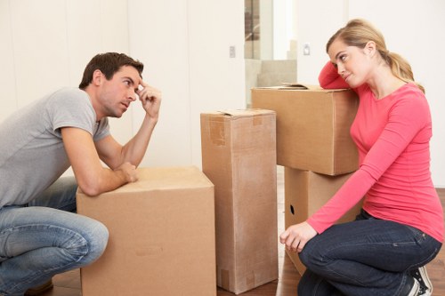 Movers handling furniture with care at a property